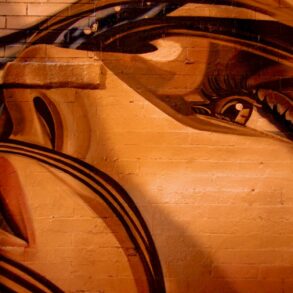 human face painting on wall