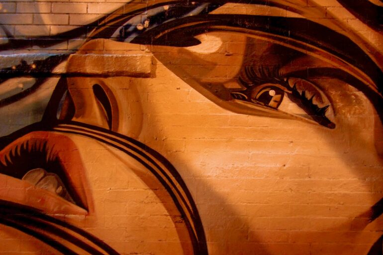 human face painting on wall